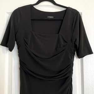 Sexy little black cocktail dress with sleeves